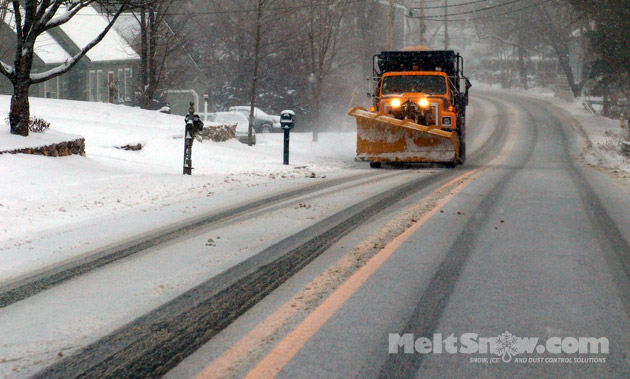 Snowplow in winter storm